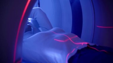 CT scanning of the spine examination for assess for herniated disk, tumors, extent of injuries, blood vessel malformations. 4k video computed tomography CT scan process for examination of spine