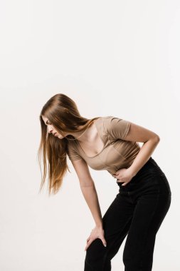 Violation of menstrual cycle in young woman. Algo dysmenorrhea. Menstruation and pain during menstruation of girl