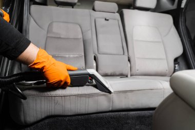 Line on textile car seat after extraction water and detergent of dry cleaning extractor machine. Dry wash cleaner is removing dirt and dust from car seat using dry cleaning extraction machine