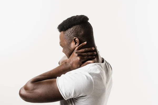 stock image Rachiocampsis bachache and neck pain of african american man on white background. Scoliosis is sideways curvature of the spine. Rheumatism and arthritis diseases