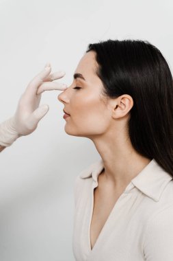 Rhinoplasty is reshaping nose surgery for change appearance of the nose and improve breathing. Consultation with ENT before rhinoplasty plastic surgery to change nose shape and improve breathing