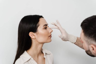 Rhinoplasty is reshaping nose surgery for change appearance of the nose and improve breathing. Consultation with ENT before rhinoplasty plastic surgery to change nose shape and improve breathing