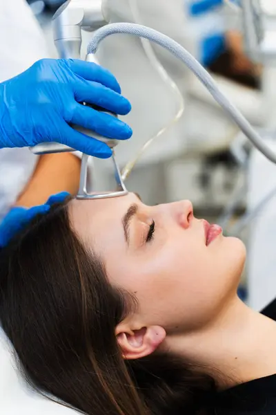 Stock image Removing wrinkles and scars through CO2 laser resurfacing. Laser skincare procedure