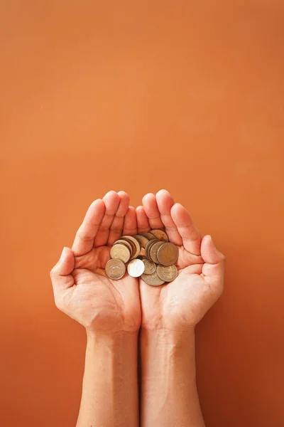 stock image hands holding coins top view