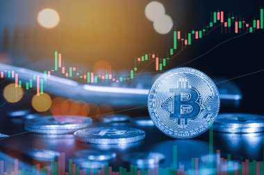 bitcoin and bitcoins on the background of the financial chart.