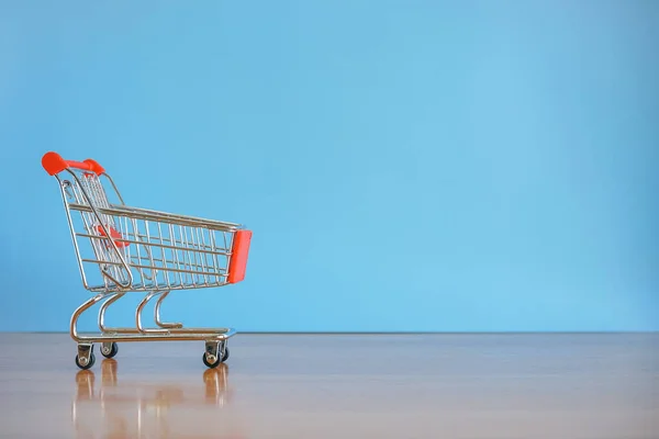 shopping cart with blue background.