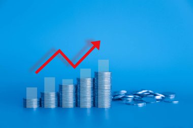 Mavi grafiğin arka planında madeni para olan grafik