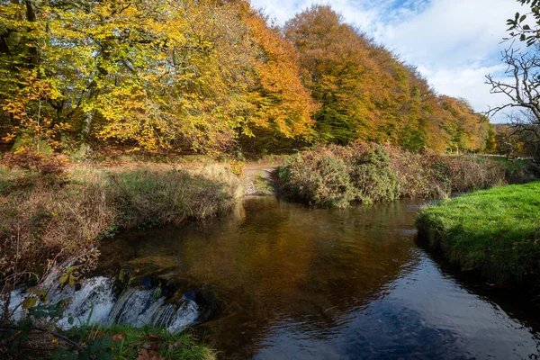 stock image The Weir Water river flowing under Robbers Bridge in Exmoor National Park