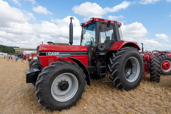 stock image Tarrant Hinton.Dorset.United Kingdom.August 25th 2022.A Case International 1455 XL is parked along a row of old Case tractors on show at the Great Dorset Steam Fair