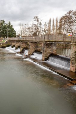 The river Tone flowing through French Weir in Taunton in Somerset