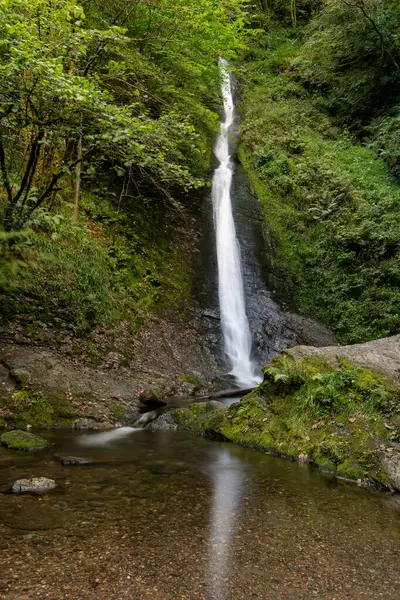 Long exposure of the White Lady waterfall on the river Lyd at Lyford Gorge in Devon