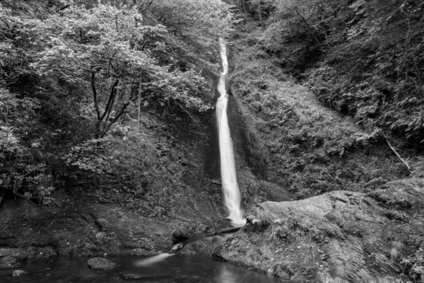Long exposure of the White Lady waterfall on the river Lyd at Lyford Gorge in Devon