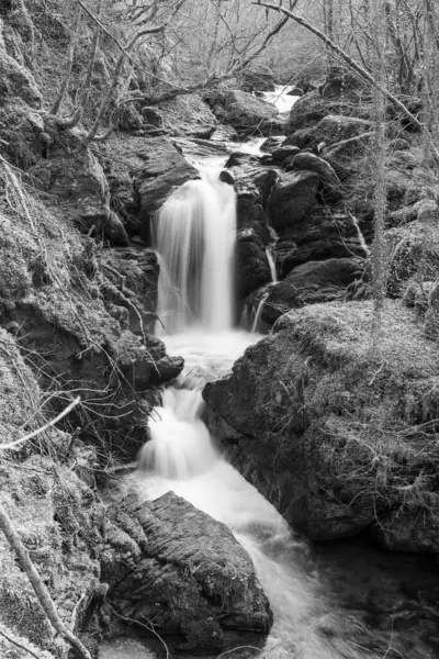 stock image Long exposure of a waterfall on the Hoar Oak Water river at Watersmeet in Exmoor National Park