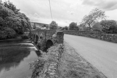 Photo of the river Barle flowing under the bridge in Withypool in Exmoor National Park clipart