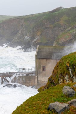 Rough seas at the Lizard Point in Cornwall during storm Kathleen on April 6th 2024 clipart