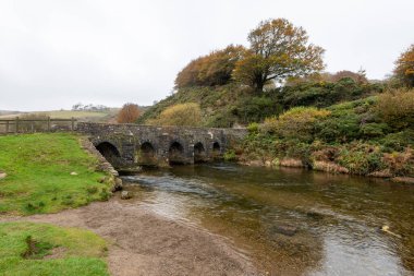 Photo of the autumn colours at Landacre bridge in Exmoor National Park clipart