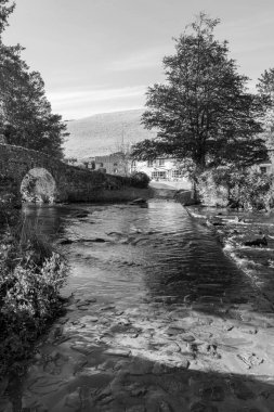 The Badgworthy water river flowing under Malmsmead bridge in Exmoor National Park clipart