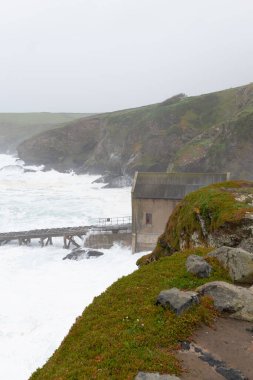 Rough seas at the Lizard Point in Cornwall during storm Kathleen on April 6th 2024 clipart