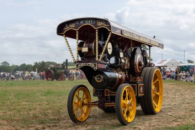 Haselbury Plucknet.Somerset.United Kingdom.August 17th 2024.A restored Fowler traction engine fron 1927 called Jubileeis being driven around the arena at a Yesterdays Farming event clipart