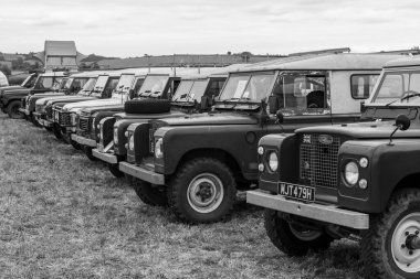 Haselbury Plucknet.Somerset.United Kingdom.August 17th 2024.A row of vintage and classic Land Rovers are on show at a Yesterdays Farming event clipart