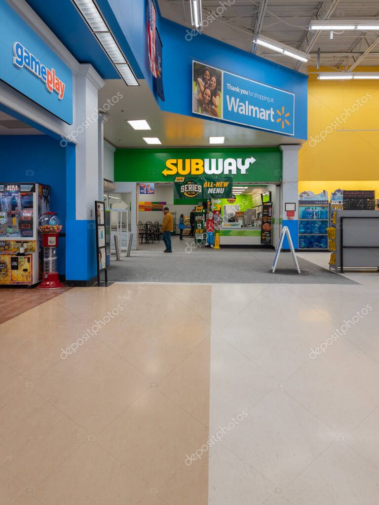 New Hartford, New York - Feb 4, 2023: Portrait Wide View of Subway Restaurant Storefront inside Walmart Supercenter.