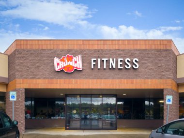 Syracuse, New York - Apr 29, 2023: Landscape Close-up View of Crunch Fitness Building Exterior. clipart