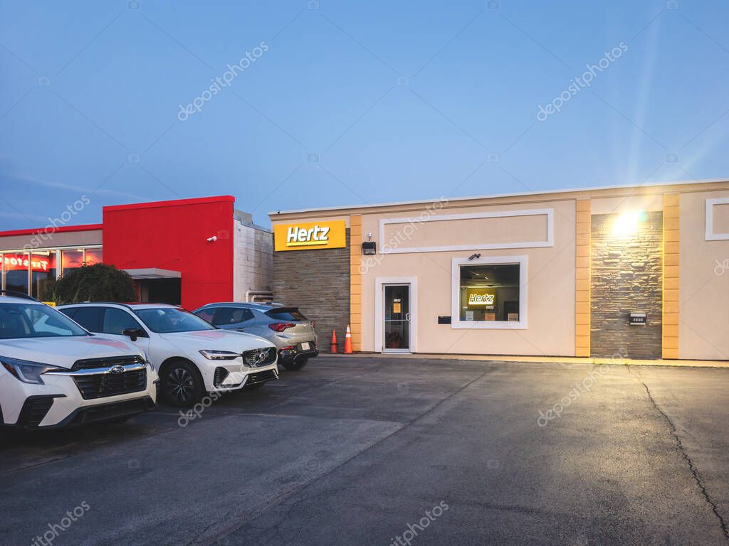 Yorkville, New York - Aug 4, 2024: Wide Landscape View of Hertz Corporation Small Branch Office Building.