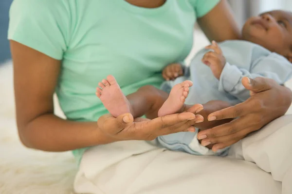 stock image Close up newborn baby's foot tiny on hand mother holding little feet infant in her palm. family warm love caring for child in motherhood touching gentle clean finger toe. happy mother's day concept.