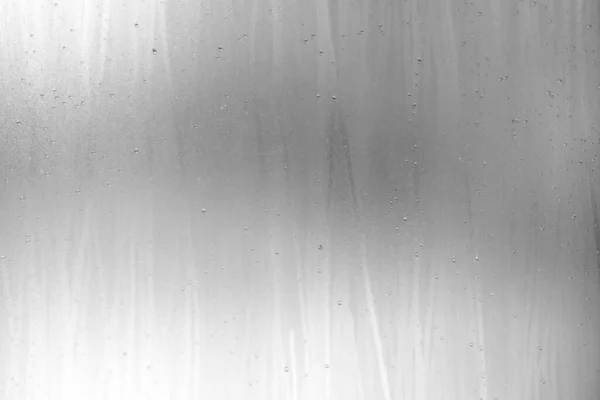 Raindrop on White Grunge Frosted Glass Background.