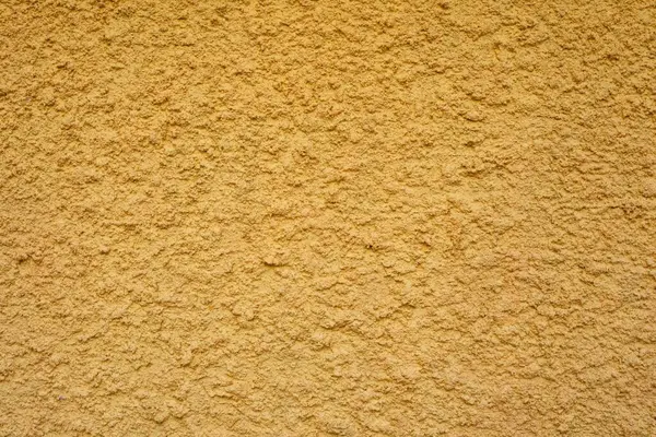 黄色のスタッコ壁テクスチャ背景 — ストック写真