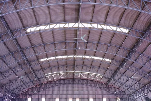 Large Warehouse Roof Structure with Hanging Fans.