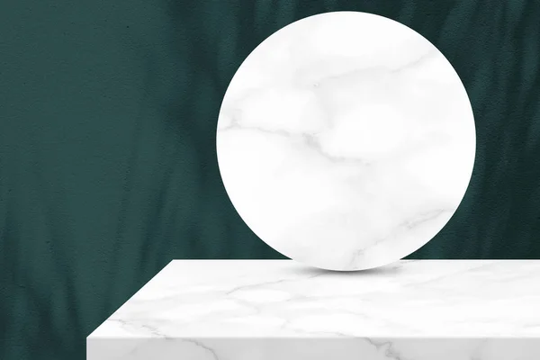 Minimal White Marble Table Corner and Circle Marble Partition with Leaves Shadow on Green Concrete Wall Texture Background, Suitable for Cosmetic Product Presentation Backdrop, Display, and Mock up.