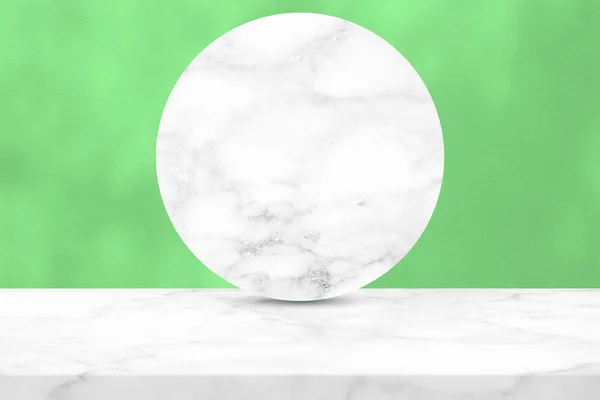 White Marble Table and Circle Marble Partition with Light and Shadow on Green Concrete Wall Texture Background, Suitable for Cosmetic Product Presentation Backdrop, Display, and Mock up.