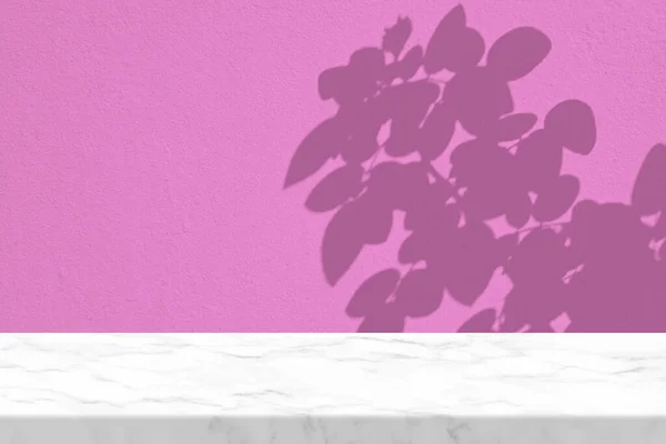 White Marble Table with Rose leaves Shadow on Pink Concrete Wall Texture Background, Suitable for Product Presentation Backdrop, Display, and Mock up.