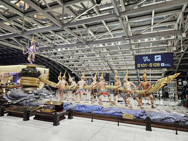 BANGKOK, THAILAND - NOVEMBER 10, 2023: Scenery of The Churning of the Ocean at Suvarnabhumi Airport. Suvarnabhumi Airport was opened in 15 September 2006.