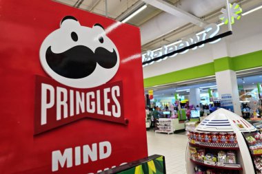 Bangkok, Thailand - April 27, 2024: Pringles sign. Pringles is an American brand of stackable potato-based chips invented by Procter and Gamble in 1968. clipart