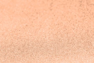 Şeftali tüyü, yılın rengi parlak kağıt dokusu. Parlak, lüks kumaş. Işıldayan altın rengi, Noel arkaplanı.