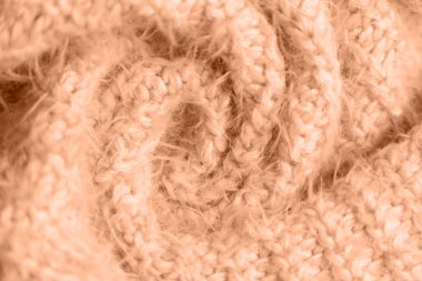 Peach fuzz, color of the year 2024, knitwear texture. Soft texture of homemade cashmere wool toned on peach fuzz color clipart