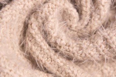 Beyaz örgü kumaş. Ev yapımı kaşmir yün süveterin yumuşak dokusu