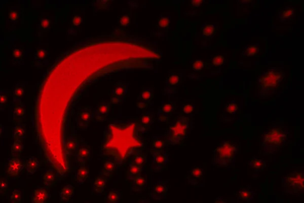 Projection of stars and moon on the wall, abstract background