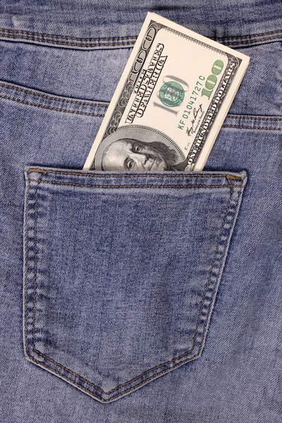 裤子口袋里夹着几百美元 收入的概念 纵向定向 图库图片