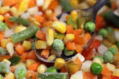 Mexican mix of frozen vegetable in spoon