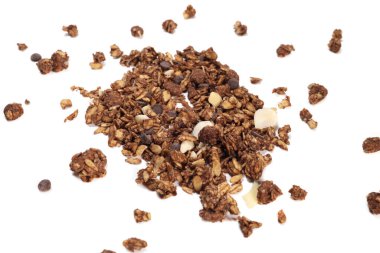 scattering of granola with oatmeal, nuts, fruits and chocolate isolated on white. The concept of healthy food, diet, weight loss.