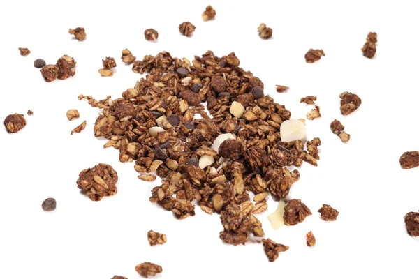 scattering of granola with oatmeal, nuts, fruits and chocolate isolated on white. The concept of healthy food, diet, weight loss.