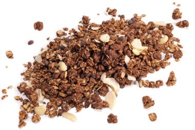 granola with oatmeal with nuts and fruits on white background, vegan concept