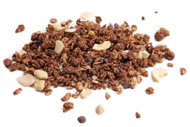 scattering of granola with oatmeal, nuts, fruits and chocolate isolated on white. The concept of healthy food, diet, weight loss.