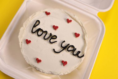 bento cake for a loved, gift for birthday and valentine's day on yellow background