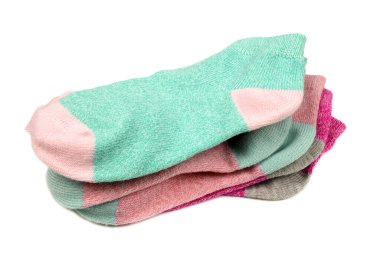 Stack of colored children's socks isolated on white