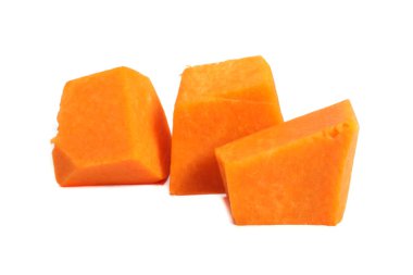 Sliced pumpkin chunks isolated on white