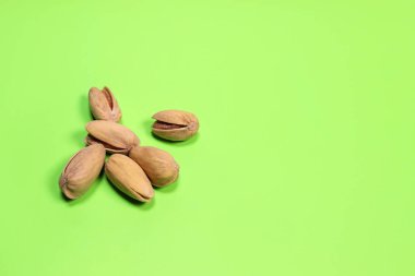 pistachios on a green background close-up macro. copy space for text